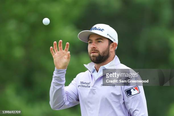 Cameron Young of the United States catches his golf ball on the first green during the final round of the 2022 PGA Championship at Southern Hills...