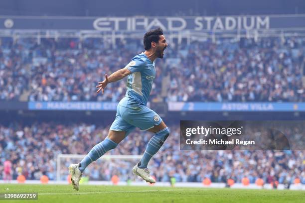 Ilkay Guendogan of Manchester City celebrates after scoring their team's third goal during the Premier League match between Manchester City and Aston...