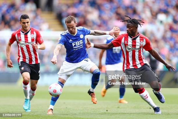 James Maddison of Leicester City is challenged by Mohammed Salisu of Southampton during the Premier League match between Leicester City and...