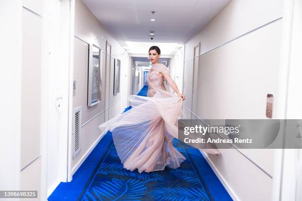 Catrinel Marlon poses for the photographer during the 75th annual Cannes film festival at on May 22, 2022 in Cannes, France.