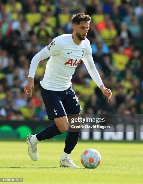 Rodrigo Bentancur of Tottenham Hotspur runs with the ball during the Premier League match between Norwich City and Tottenham Hotspur at Carrow Road...