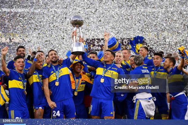 Carlos Izquierdoz and Marcos Rojo of Boca Juniors lift t trophy as they become champions of the Copa de la Liga 2022 after winning the final match of...