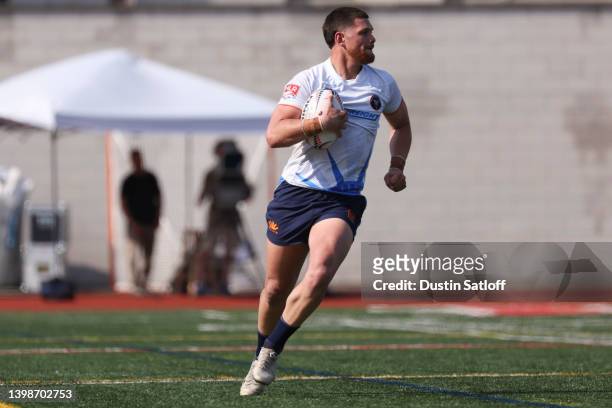 Quinn Ngawati of Rugby New York runs the ball in the second half of the Major League Rugby match against Rugby ATL at JFK Stadium on May 22, 2022 in...