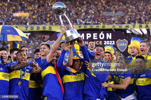 Carlos Izquierdoz and Marcos Rojo of Boca Juniors a teammates lift the trophy as they become champions of the Copa de la Liga 2022 after winning the...