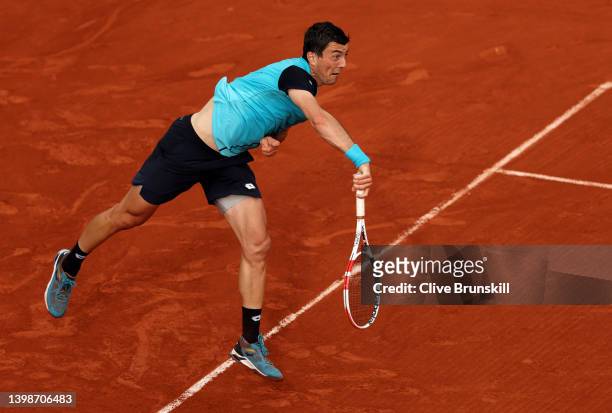 Sebastian Ofner of Austria serves against Alexander Zverev of Germany in their mens singles first round match during the 2022 French Open at Roland...