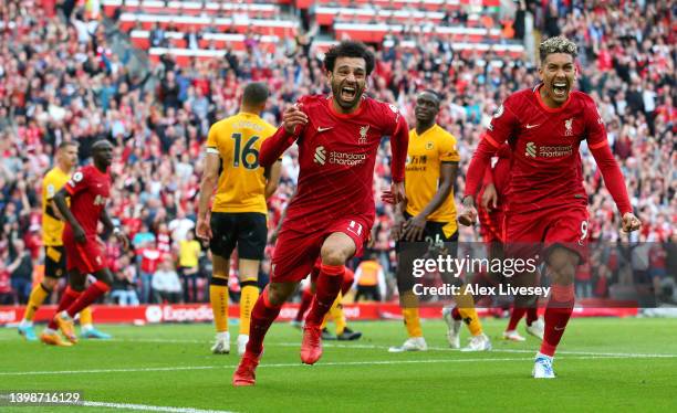 Mohamed Salah of Liverpool celebrates after scoring their sides second goal during the Premier League match between Liverpool and Wolverhampton...