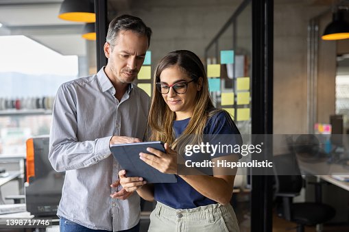 Associate Working On Line Business Team Working Online At The Office Using A Tablet High-Res ...