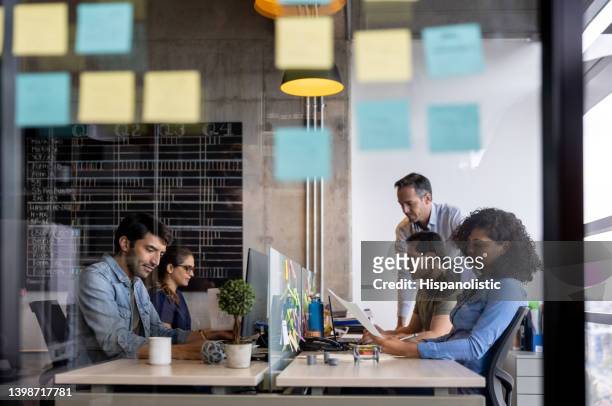 group of creative workers working at the office - new business stock pictures, royalty-free photos & images