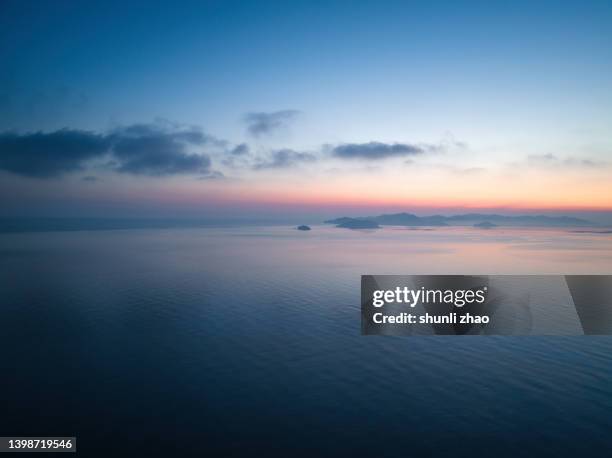 aerial view of sea at sunrise - crepúsculo - fotografias e filmes do acervo