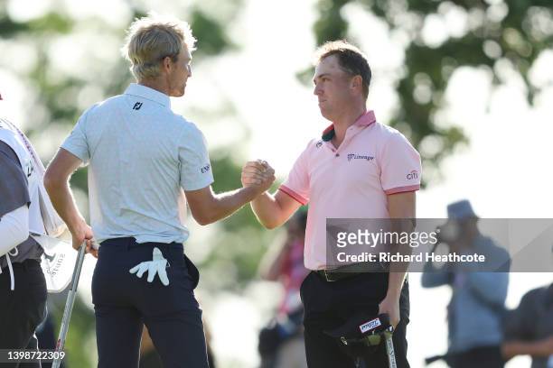 Justin Thomas of the United States shakes hands with Will Zalatoris of the United States on the 18th green, the third playoff hole during the final...