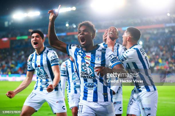 Romario Ibarra of Pachuca celebrates with teammate Aviles Hurtado after scoring his team’s first goal during the semifinal second leg match between...