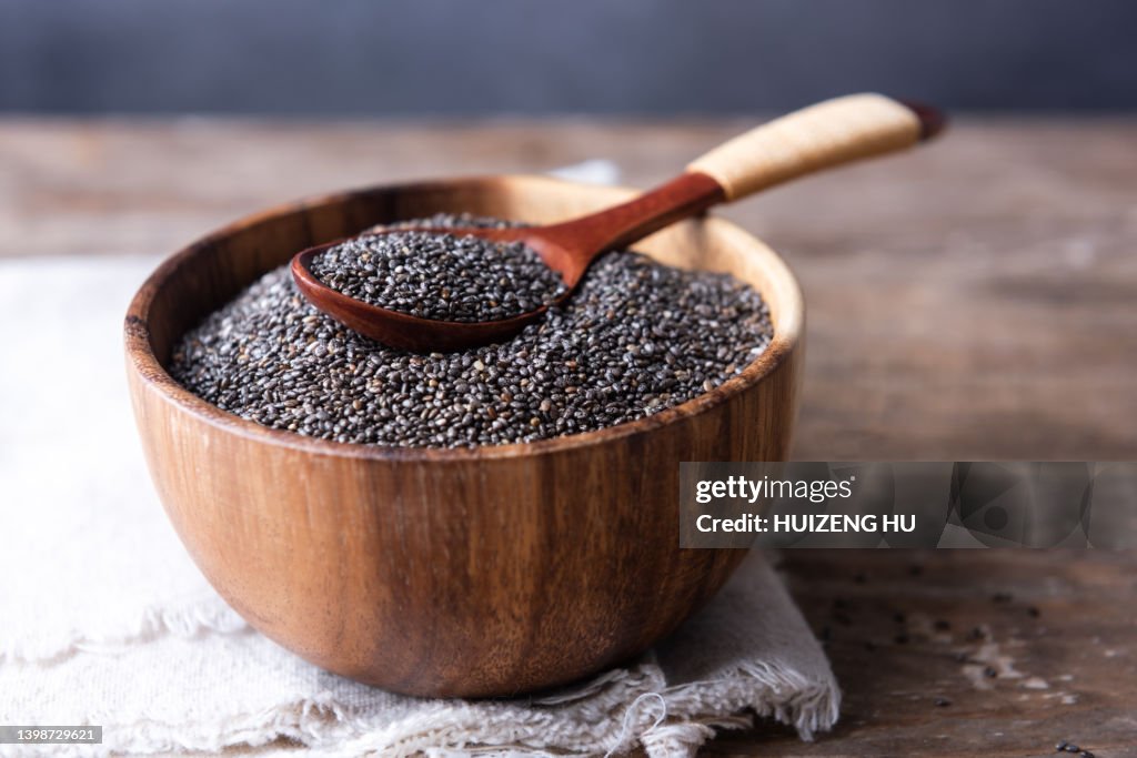 Bowl and spoon with chia seeds closeup