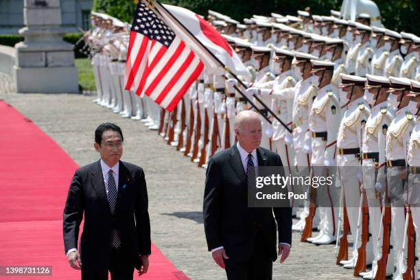 President Joe Biden reviews an honour guard with Japanese Prime Minister Fumio Kishida during a welcome ceremony for President Biden at the Akasaka...