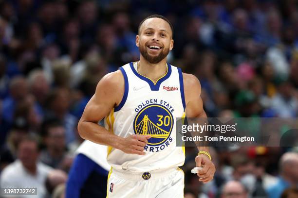 Stephen Curry of the Golden State Warriors reacts to a play during the second quarter against the Dallas Mavericks in Game Three of the 2022 NBA...