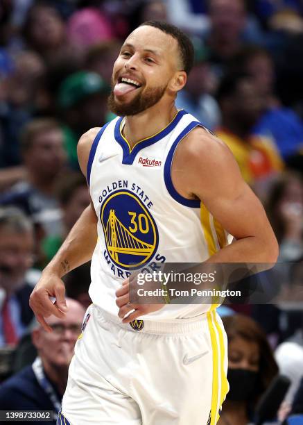 Stephen Curry of the Golden State Warriors reacts to a play during the second quarter against the Dallas Mavericks in Game Three of the 2022 NBA...