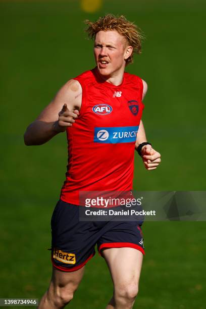 Clayton Oliver of the Demons gestures during a Narrm / Melbourne Demons AFL training session at Olympic Park on May 23, 2022 in Melbourne, Australia.