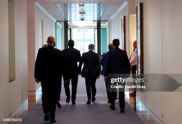 Prime Minister Anthony Albanese walks past his new office after attending a press conference at Parliament House on May 23, 2022 in Canberra,...