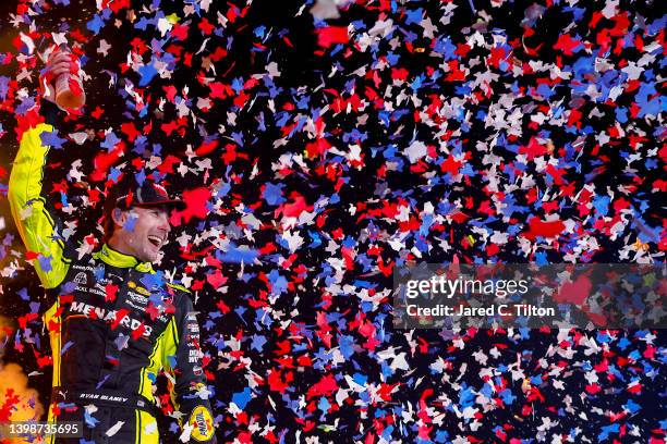 Ryan Blaney, driver of the Menards/Wrangler Ford, celebrates in victory lane after winning the NASCAR Cup Series All-Star Race at Texas Motor...