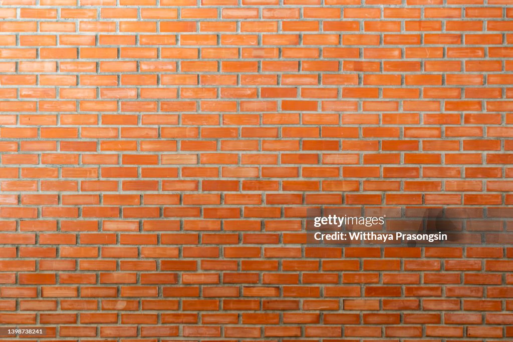 Red brick wall seamless background.