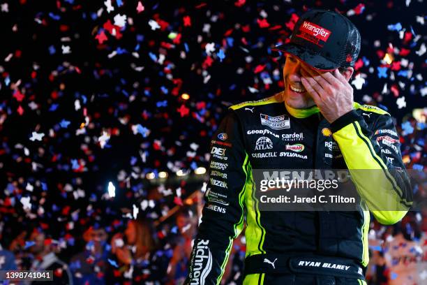 Ryan Blaney, driver of the Menards/Wrangler Ford, celebrates in victory lane after winning the NASCAR Cup Series All-Star Race at Texas Motor...