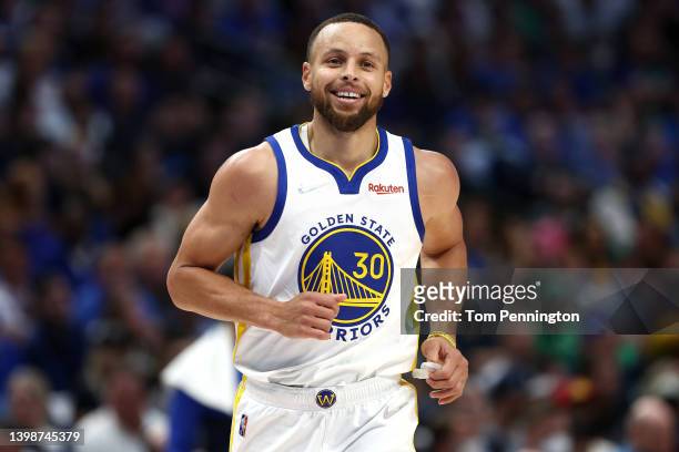 Stephen Curry of the Golden State Warriors reacts to a play during the second quarter against the Dallas Mavericks in Game Three of the 2022 NBA...