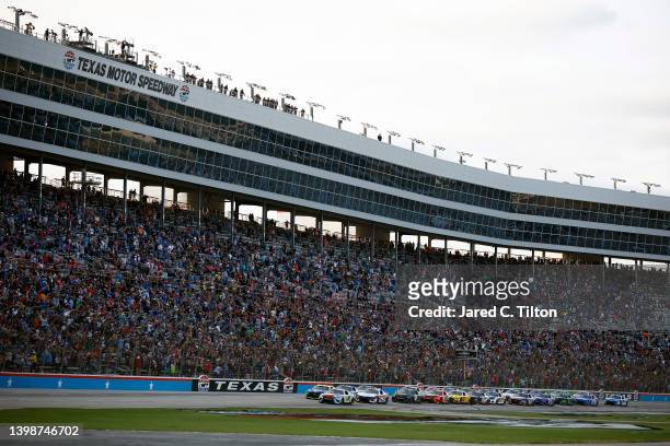 Kyle Busch, driver of the M&M's Crunchy Cookie Toyota, leads the field to start the NASCAR Cup Series All-Star Race at Texas Motor Speedway on May...
