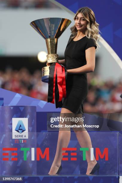 Hostess carries the Scudetto trophy to it's pedestal during trophy presentation following the Serie A match between US Sassuolo and AC Milan at Mapei...