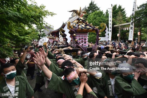 Shrine parishioners carry a portable shrine during the Asakusa Sanja Festival on May 22, 2022 in Tokyo, Japan.
