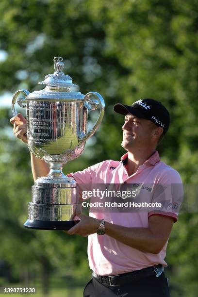 Justin Thomas of the United States poses with the Wanamaker Trophy after beating Will Zalatoris in a playoff to win during the final round of the...