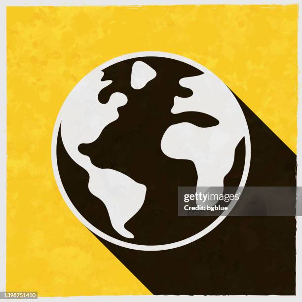 world - planet earth. icon with long shadow on textured yellow background - planet earth texture stock illustrations