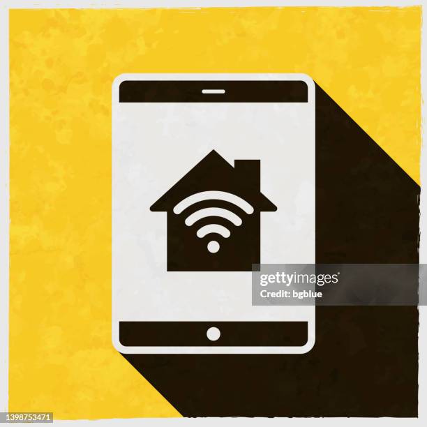tablet pc with smart home. icon with long shadow on textured yellow background - using tablet home stock illustrations