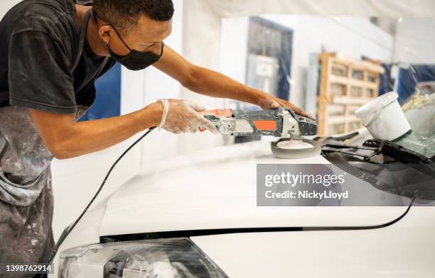 worker preparing the car surface before coating at auto repair shop - surface preparation stock pictures, royalty-free photos & images