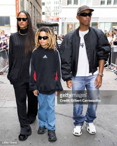 Helen Lasichanh, Rocket Ayer Williams and Pharrell Williams are seen leaving the Balenciaga Spring 2023 fashion show at New York Stock Exchange on...