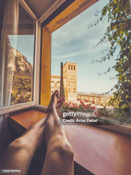 contemplating the montserrat monastery from window with amazing views. - barcelona free stock-fotos und bilder