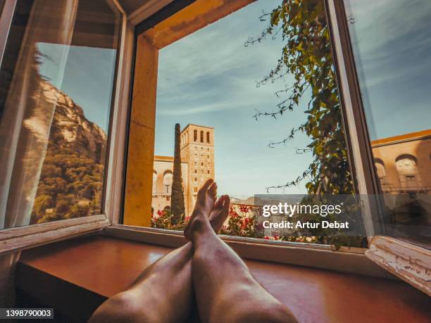 contemplating the montserrat monastery from window with amazing views. - landmark hotel stock pictures, royalty-free photos & images