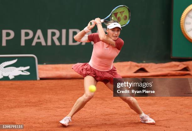 Ana Bogdan of Romania plays a backhand against Victoria Azarenka during the Women's Singles First Round match on Day 2 of The 2022 French Open at...