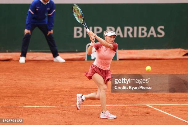 Ana Bogdan of Romania plays a backhand against Victoria Azarenka during the Women's Singles First Round match on Day 2 of The 2022 French Open at...