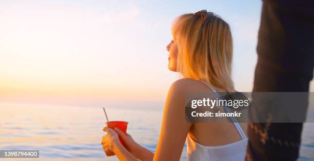 woman looking at view - sea cup stock pictures, royalty-free photos & images