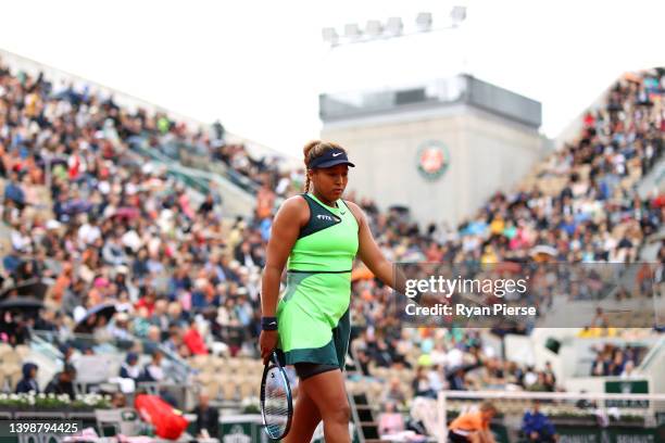 Naomi Osaka of Japan reacts after losing against Amanda Anisimova of USA during the Women's Singles First Round match on Day 2 of The 2022 French...