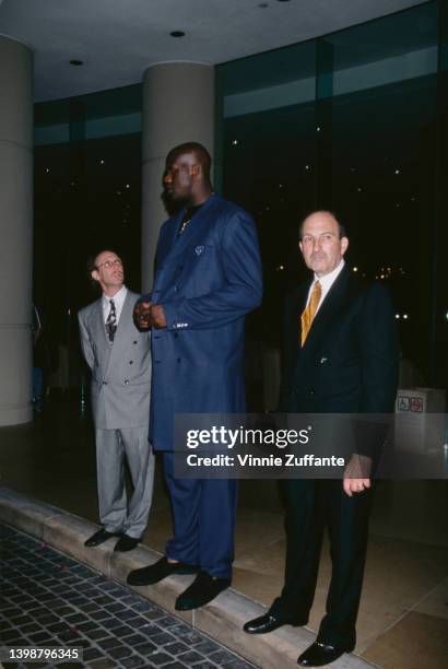 American basketball player Shaquille O'Neal, standing between two men, attends the Fulfillment Fund 'Courage to Dream' Awards, held at the Beverly...