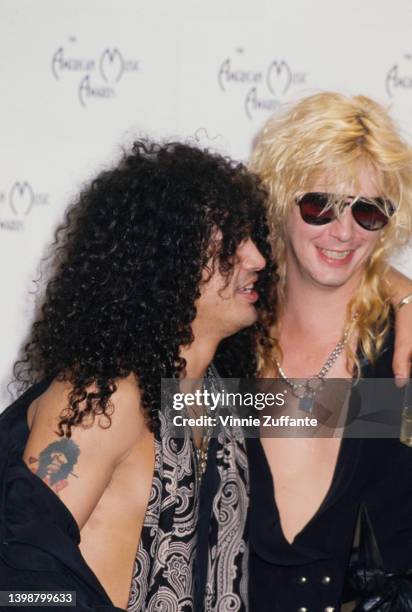 British�American guitarist Slash and his Guns n' Roses bandmate, American guitarist and songwriter Duff McKagan attend the 17th Annual American Music...