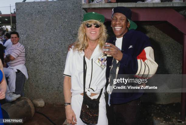 American drummer and songwriter Steven Adler, wearing the kit of the Salamanders, and a man attend MTV's inaugural Rock N' Jock Diamond Derby, held...