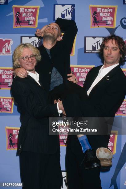 American rock band REM in the press room of the 1998 MTV Europe Music Awards, held at the Fila Forum in Assago, Milan, Italy, 12th November 1998.