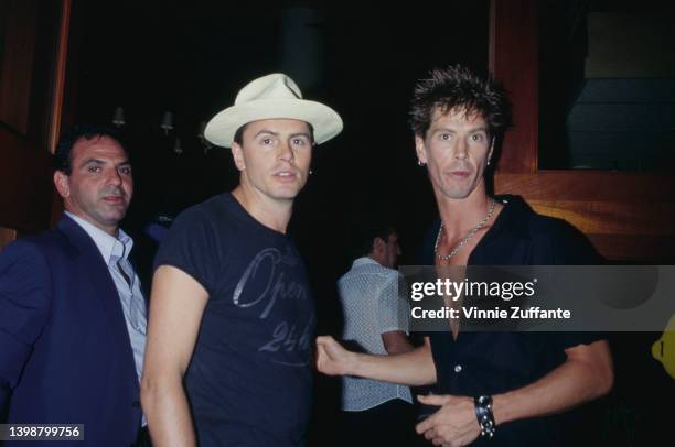 British guitarist and songwriter John Taylor and American guitarist and songwriter Duff McKagan attend the Maverick Records after party, held at the...