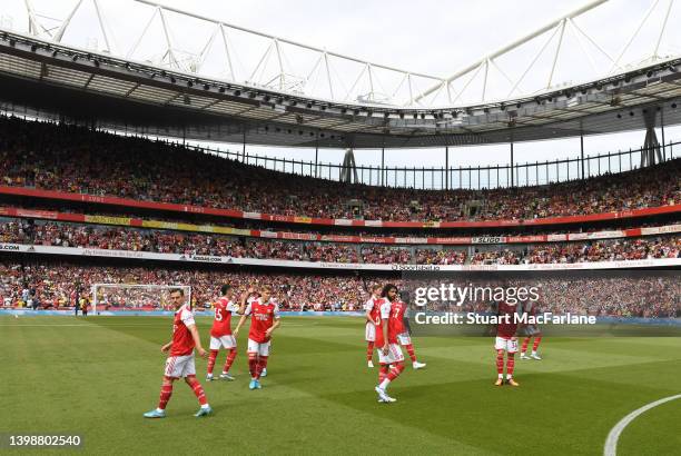 The Arsenal team prepare for kick off before the Premier League match between Arsenal and Everton at Emirates Stadium on May 22, 2022 in London,...