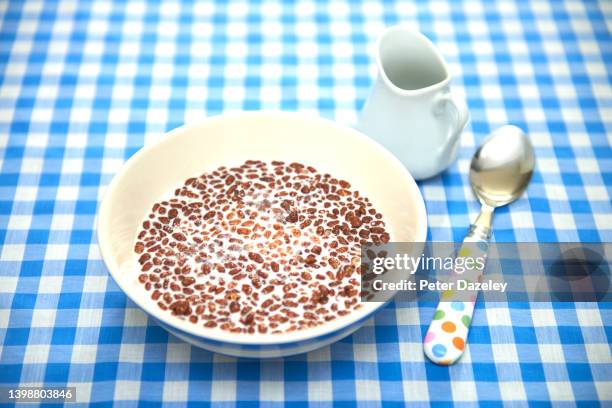 chocolate cereal with milk - blue bowl stock-fotos und bilder