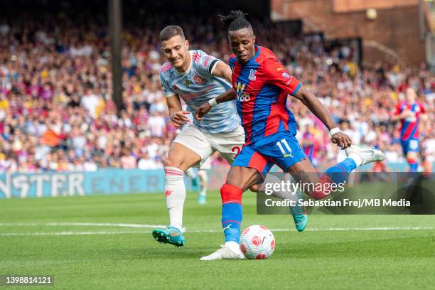 Wilfried Zahai of Crystal Palace and Diogo Dalot of Manchester United in action during the Premier League match between Crystal Palace and Manchester...