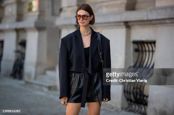 Jacqueline Zelwis is seen wearing black Arakii Blazer, Zara Top, Anine Bing leather shorts, Fendi Boots, Strathberry bag, Corlin Eyewear sunglasses...