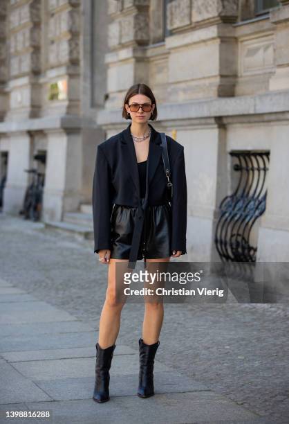 Jacqueline Zelwis is seen wearing black Arakii Blazer, Zara Top, Anine Bing leather shorts, Fendi Boots, Strathberry bag, Corlin Eyewear sunglasses...