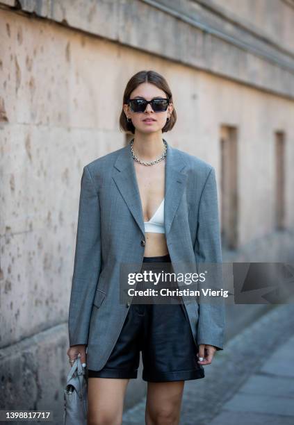 Jacqueline Zelwis is seen wearing grey Vintage Boss Blazer, LeGer Bra, Ivy Oak black leather shorts, LeGer Boots, 3.1 Phillip Lim bag, House of...